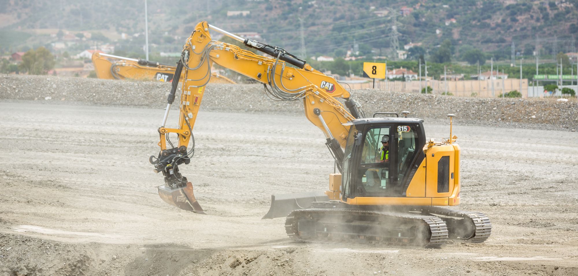 Wind trubine with cat excavator