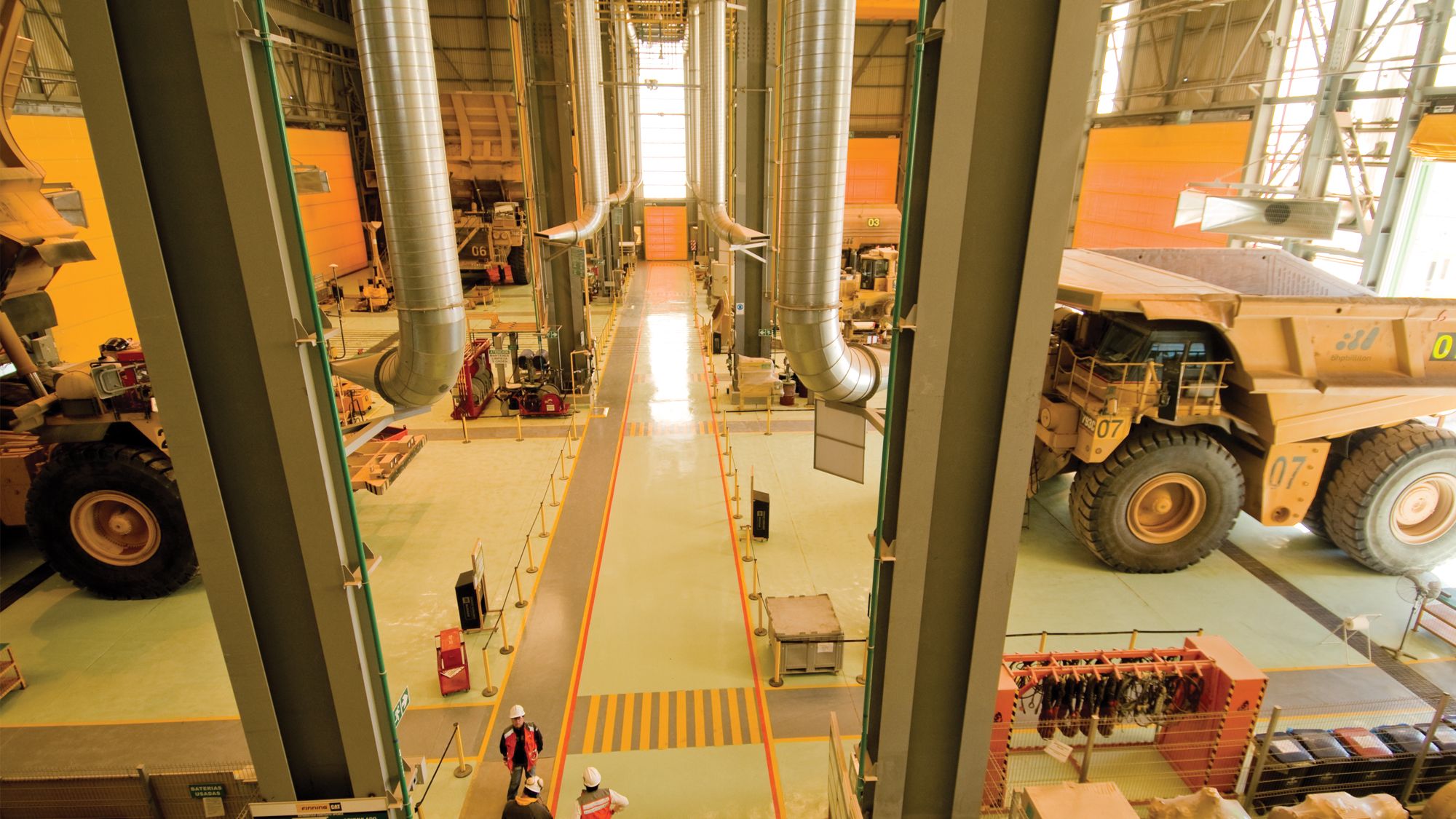 Cat mining trucks in service facility