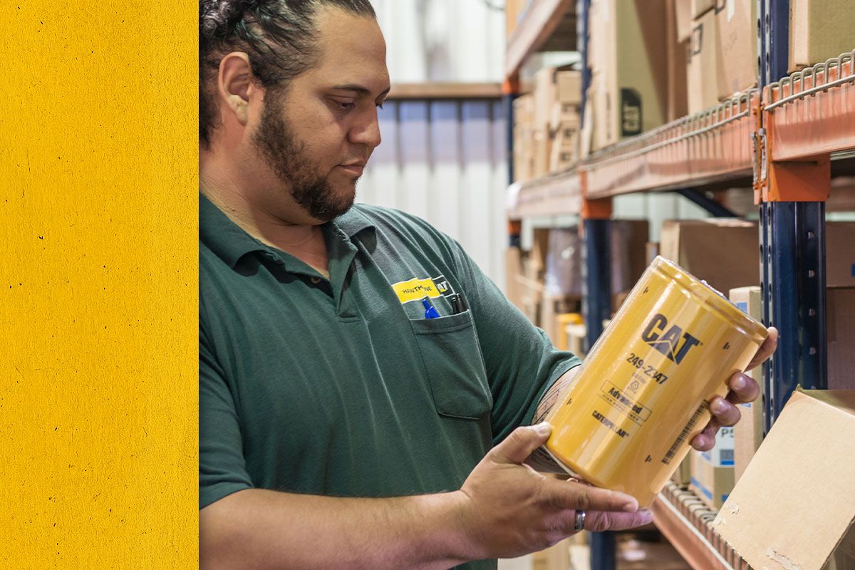 Close up of Cat dealer looking at a Cat Filter