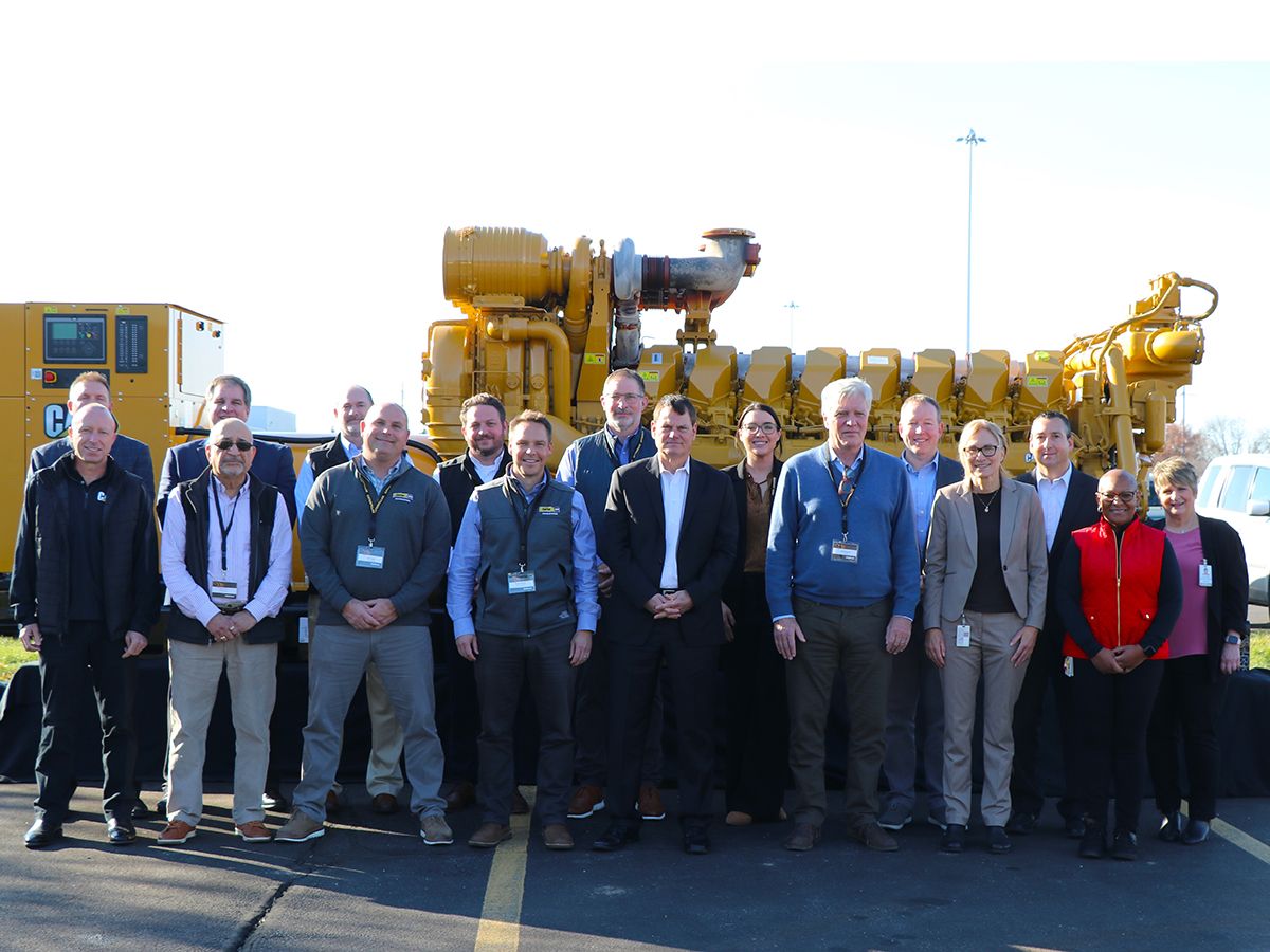 Representatives from Caterpillar, CloudHQ and Carter Machinery celebrate the production of the 10,000th engine on the Cat® C175 diesel platform