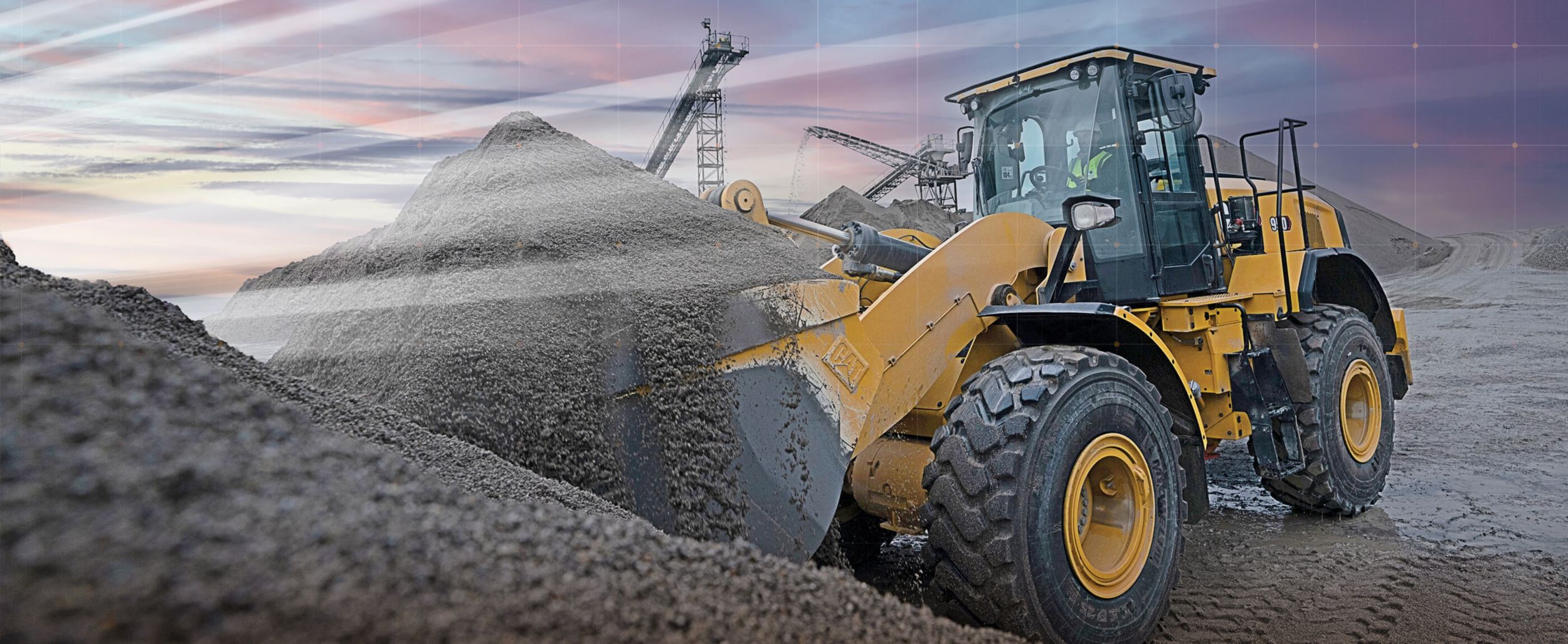 Cat® Wheel Loader lifting dirt with graphic rays of sun shining
