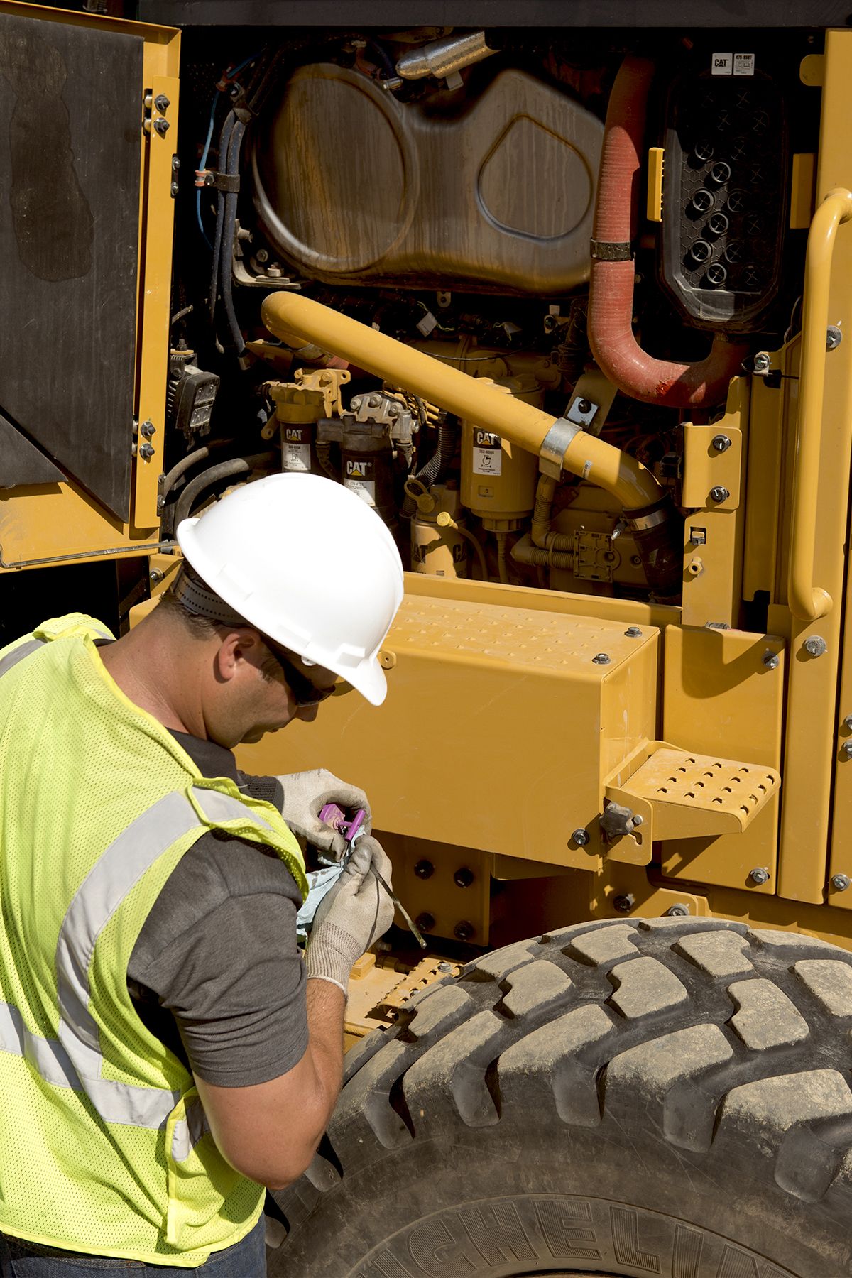 worker repairing a machine