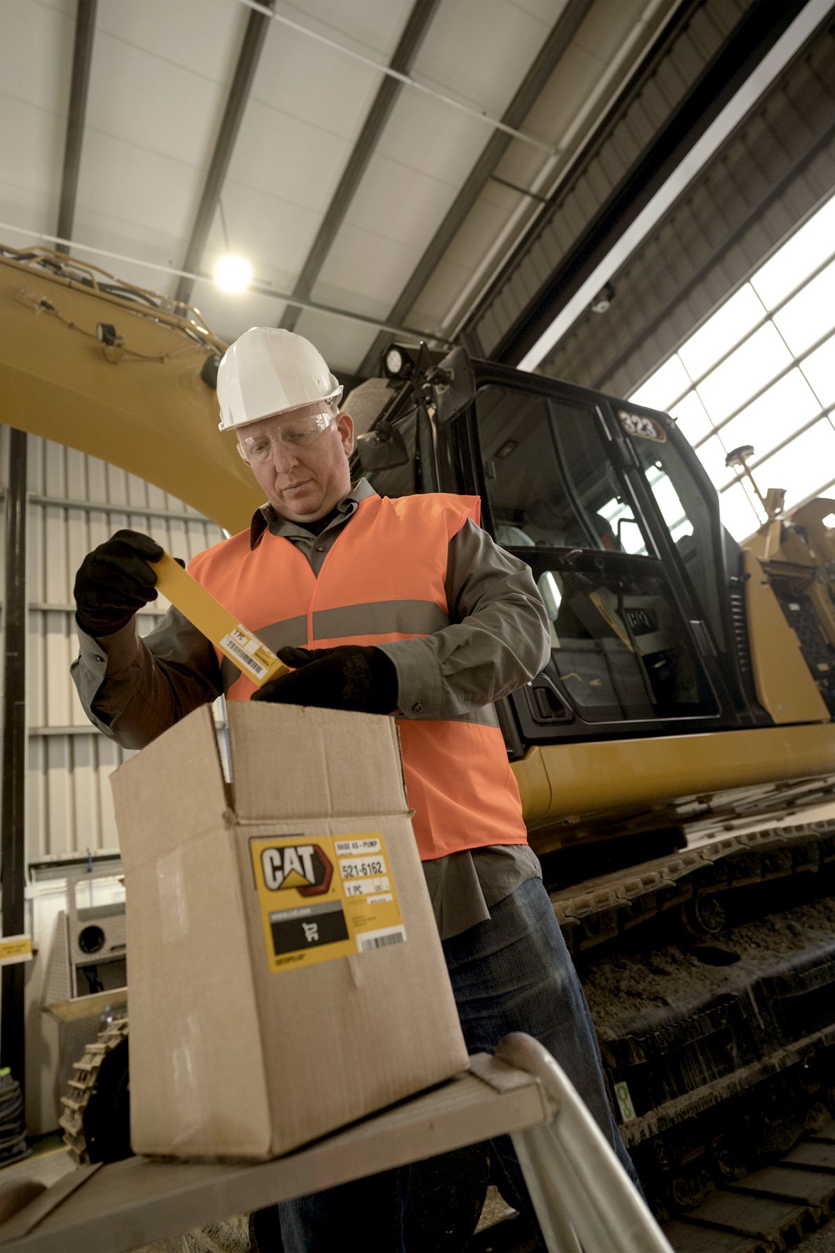 worker checking the contents of a box
