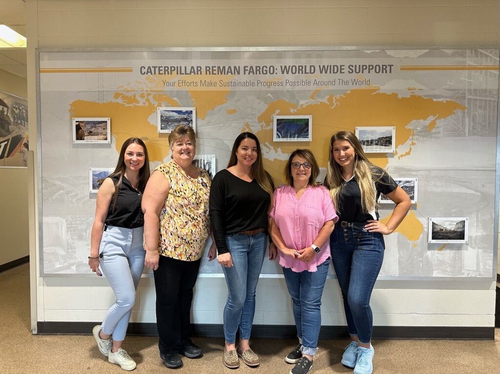 Reman employees in office hallway