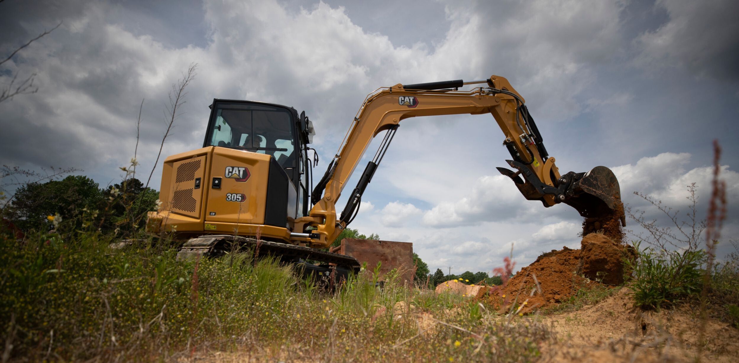Cat Mini Excavator workin on jobsite