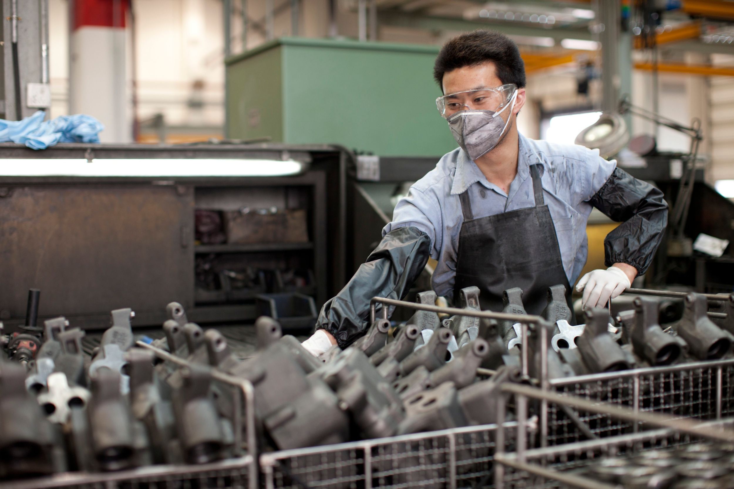 Male employee working with components