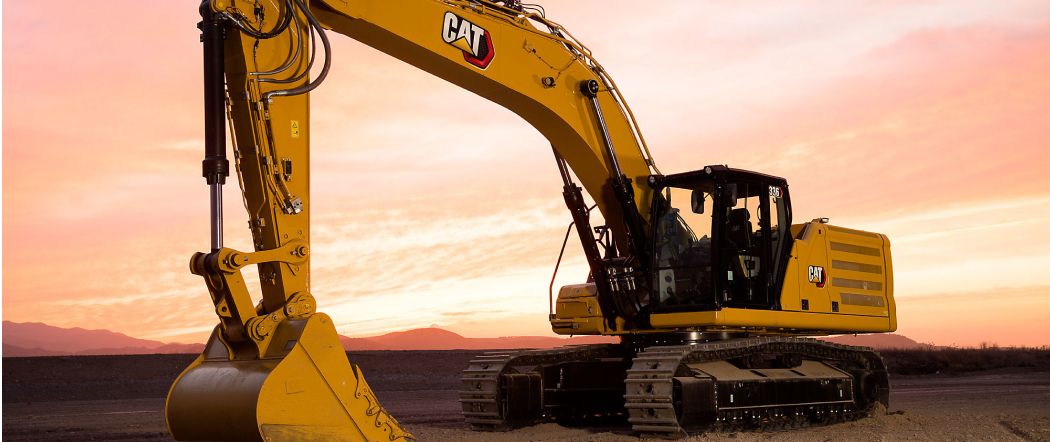 Cat excavator at sunset