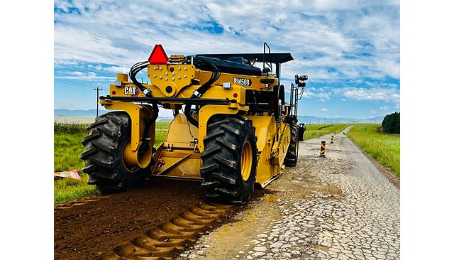 Cat RM500 road reclaimer/soil stabilizer reclaiming an asphalt road