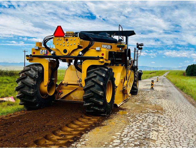 Cat RM500 road reclaimer/soil stabilizer reclaiming an asphalt road