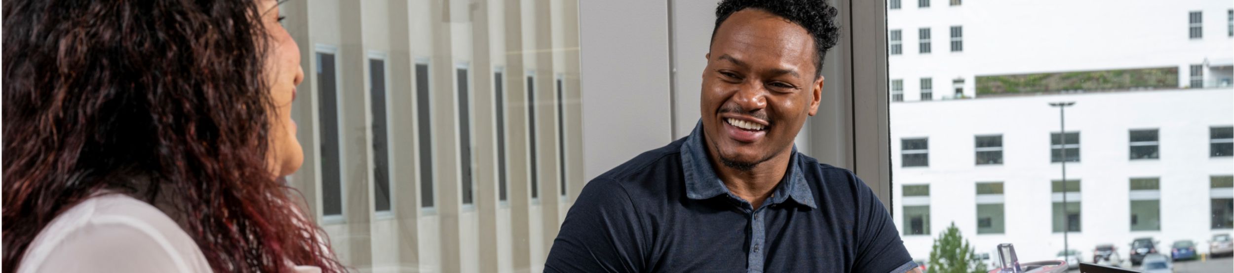 A male and female employee talking