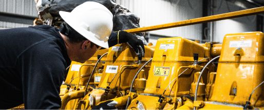 A technician looking at a Cat engine