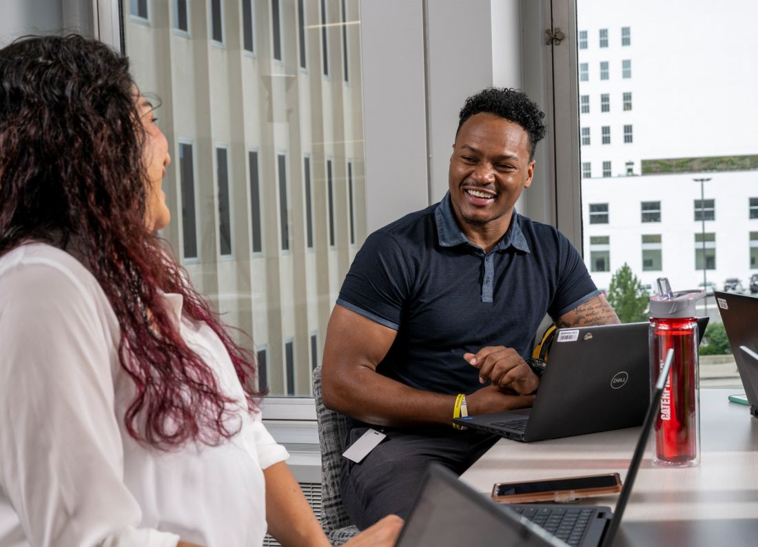 A male and female employee talking