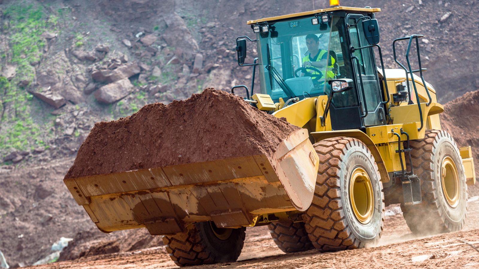 950 GC Wheel Loader dumping dirt on jobsite
