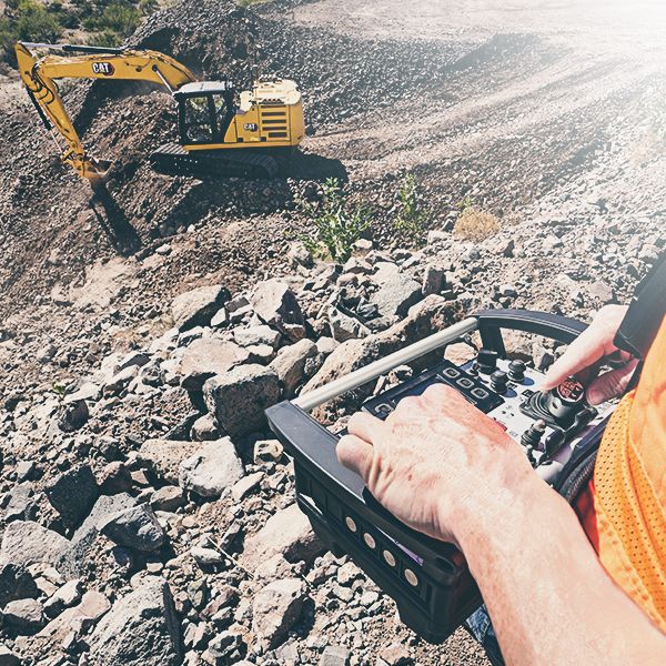 Operator using remote console with an Excavator