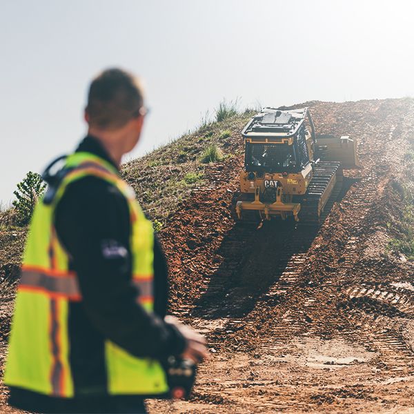 Operator using remote console with a Dozer
