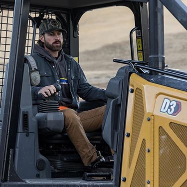 Riley Green operating a Cat D3 Dozer