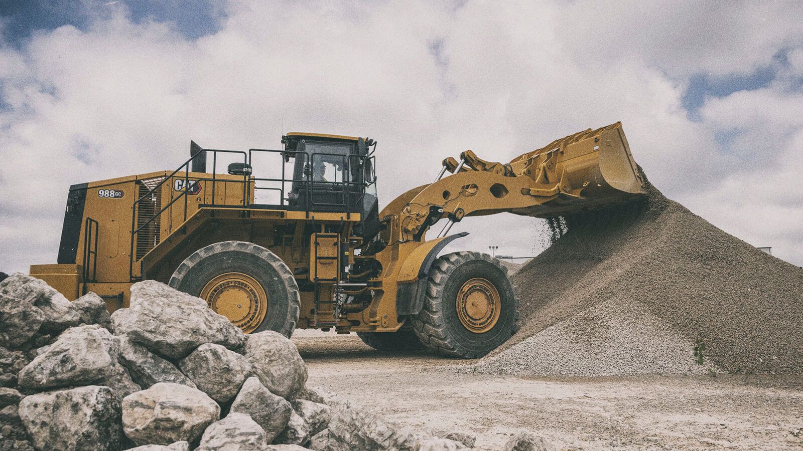 988 GC Wheel Loader dumping material on jobsite
