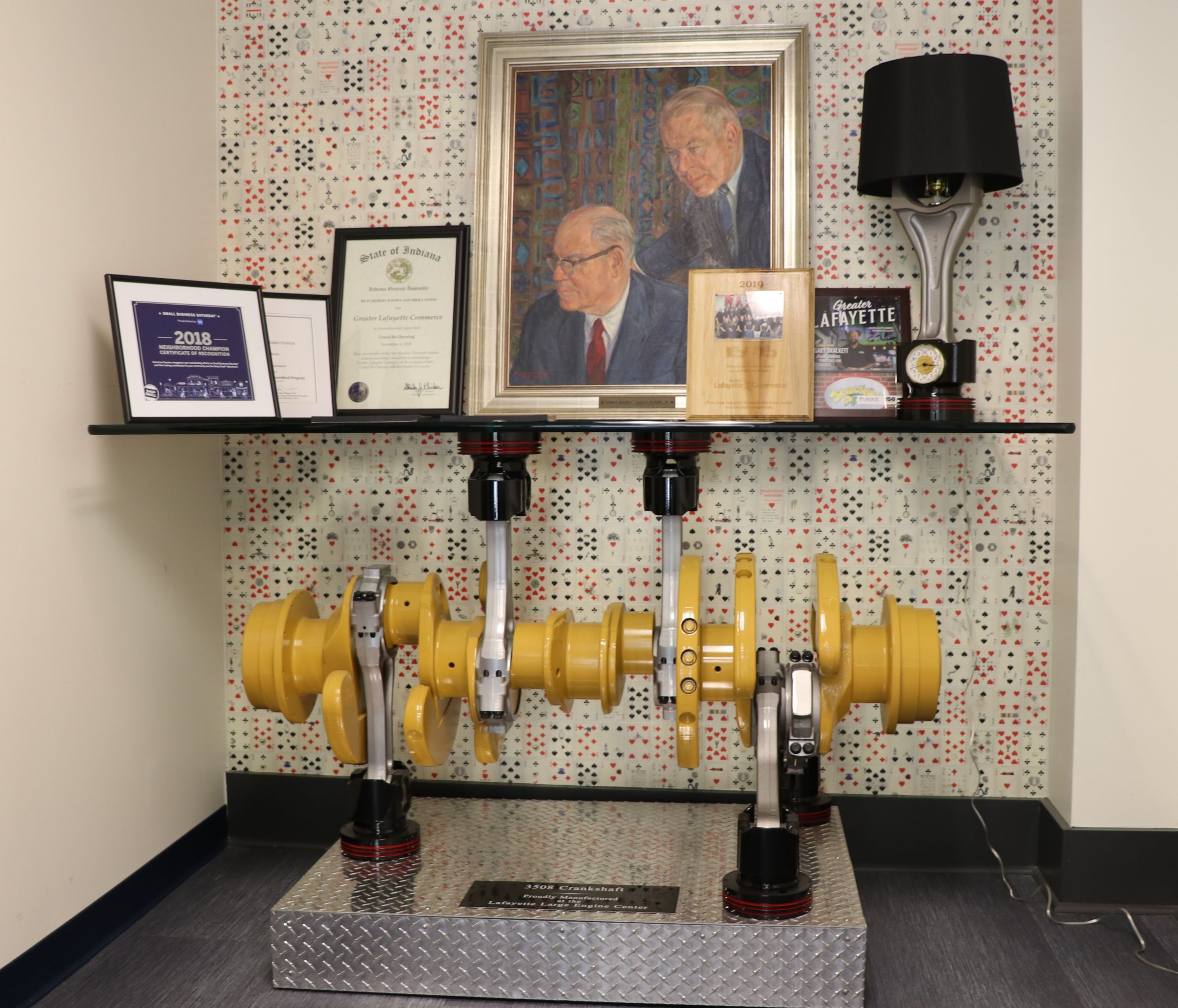 A coffee table made from a 3508 crankshaft and 3500 pistons