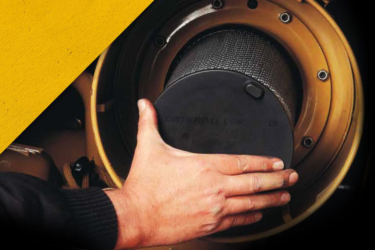 Close up of a hand installing a Cat Filter