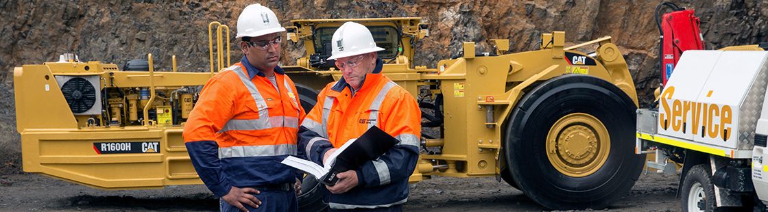 Two men wearing orange high-vis jackets
