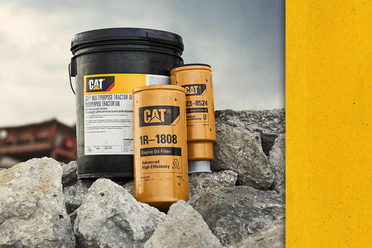 Up close view of Cat Oil and Oil Filters on a pile of rocks