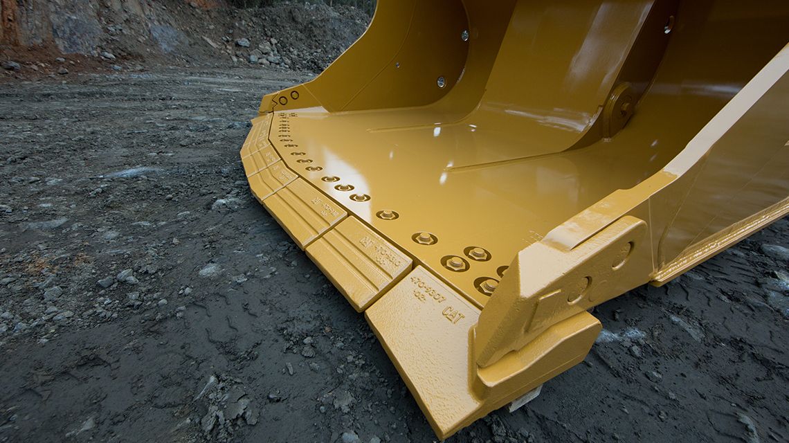 close up shot of bucket blade on ground