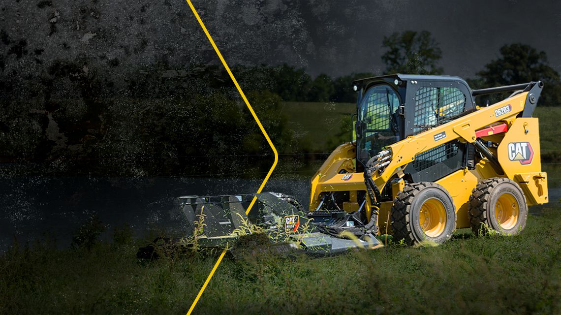 Cat track loader in grass field with arrow graphic