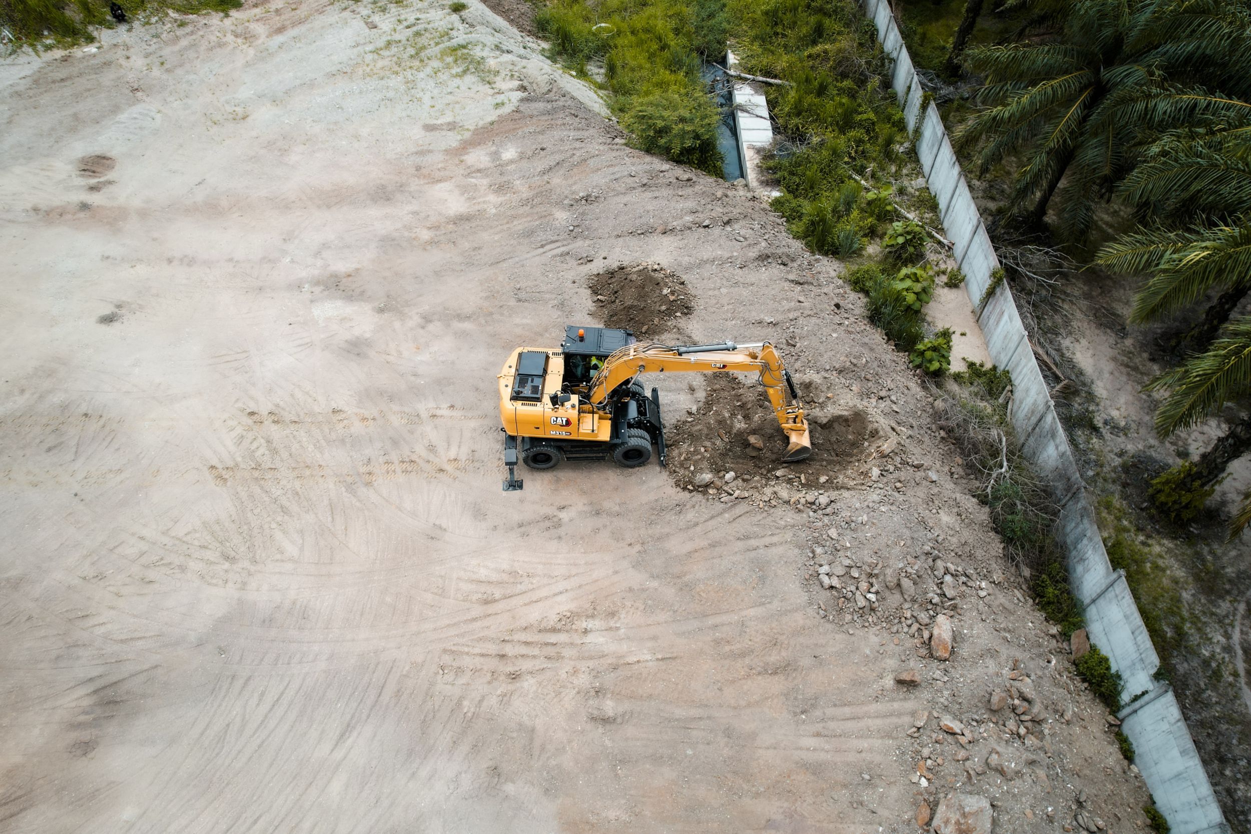 Escavação com Escavadeira de Rodas M315 GC