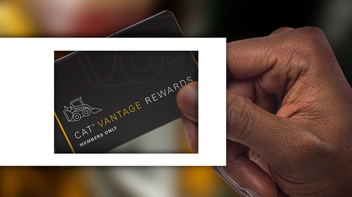 Hand holding Cat Vantage Reward card