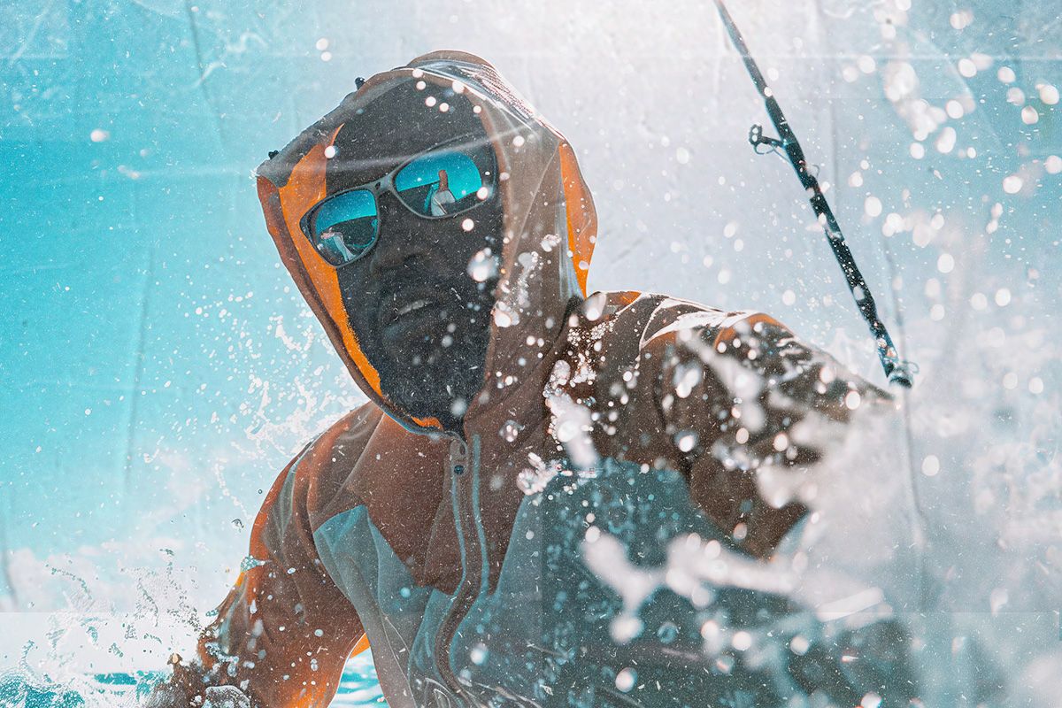 Fisherman on the water with waves splashing