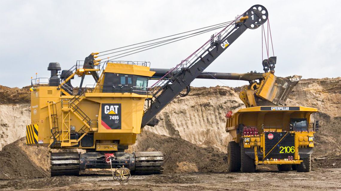 two cat machines working together at a mining site
