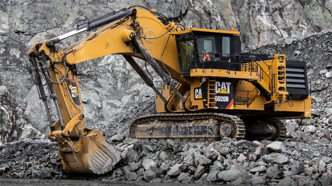 Large excavator on rocks