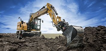M315 Cat Excavator moving dirt on jobsite