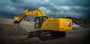 336 Cat Excavator moving dirt on jobsite