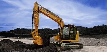 315 Cat Excavator moving dirt on jobsite