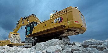 395 Cat Excavator moving dirt on jobsite