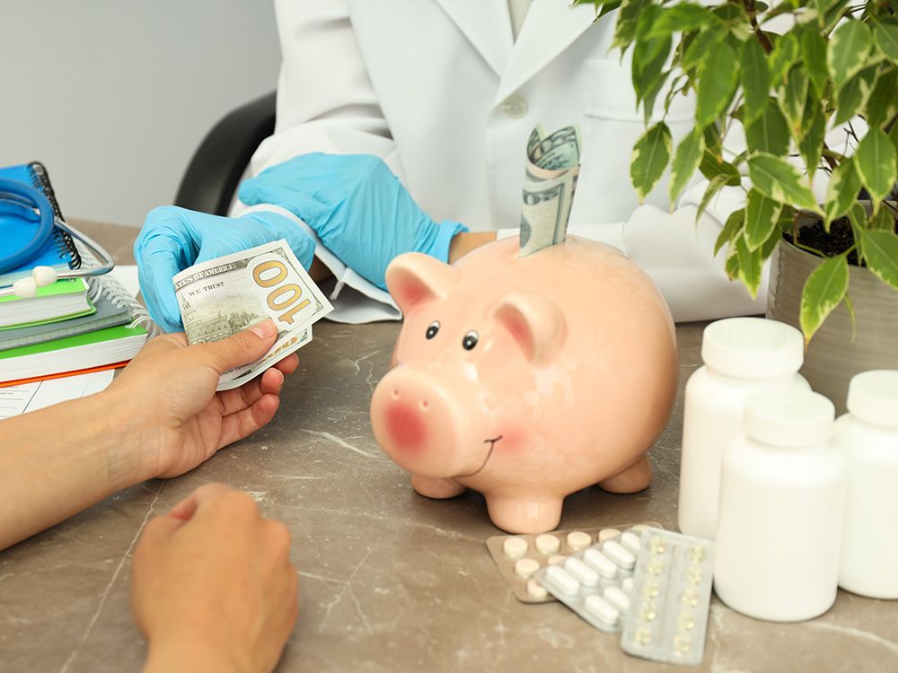 Person handing money to a medical professional