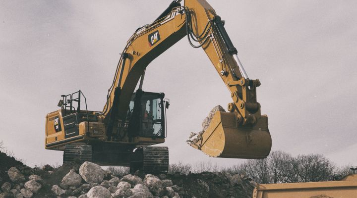 336 Excavator picking up stones on jobsite