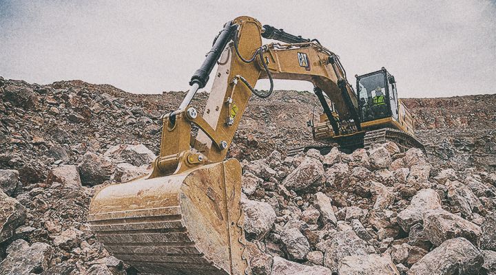 336 Excavator picking up stones on jobsite