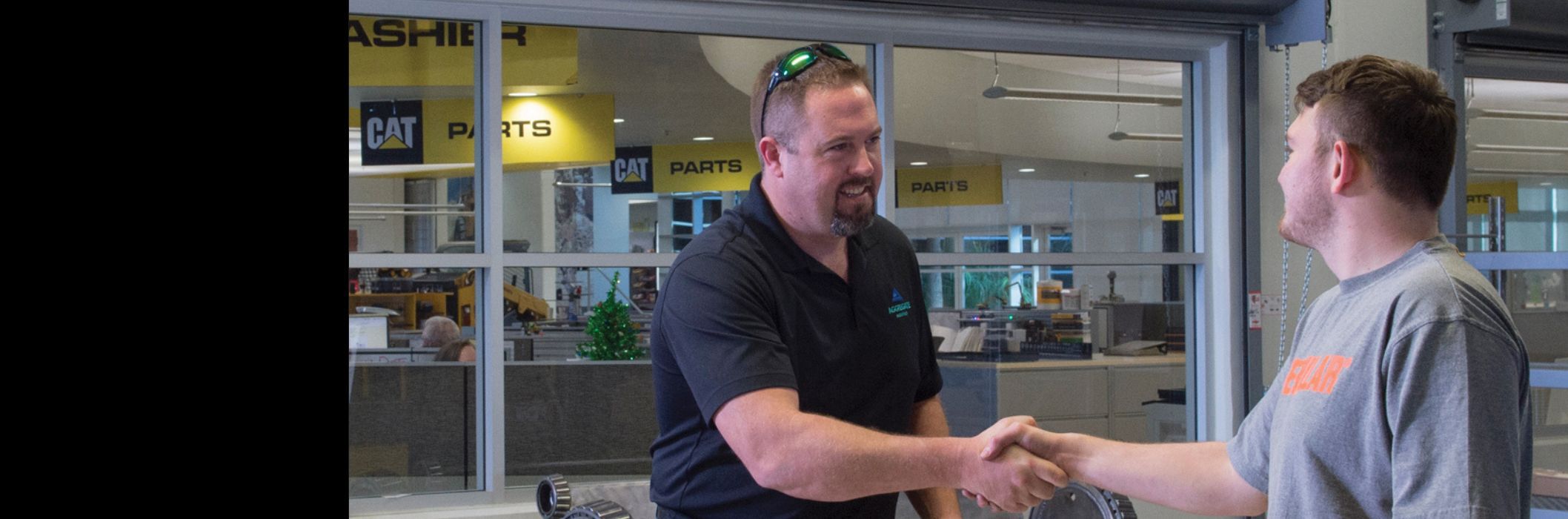 Cat Dealer and Happy Parts Customer