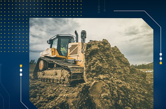 Dozer pushing dirt on a jobsite with blue banner