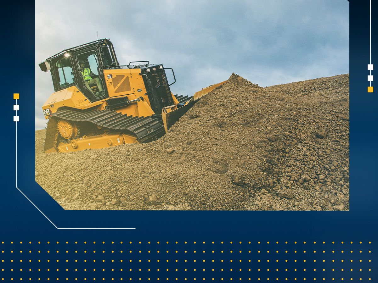 Dozer pushing dirt on a jobsite with blue banner