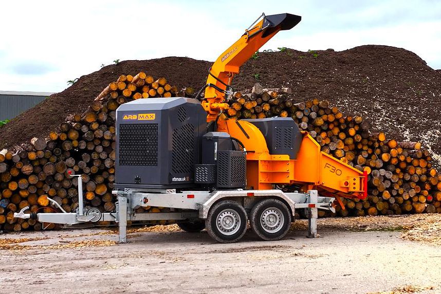 image 1 - ARBMAX F30 in front of a woodpile