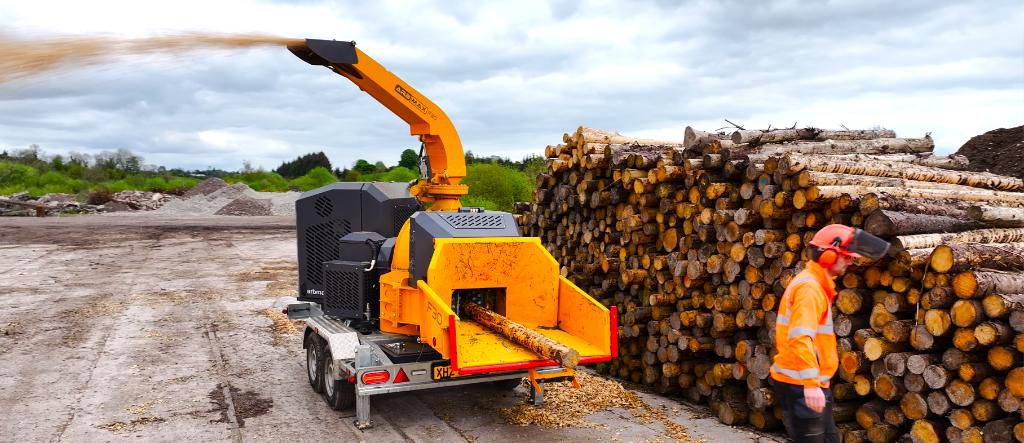 Image 3 - ARBMAX F30 working in front of a woodpile