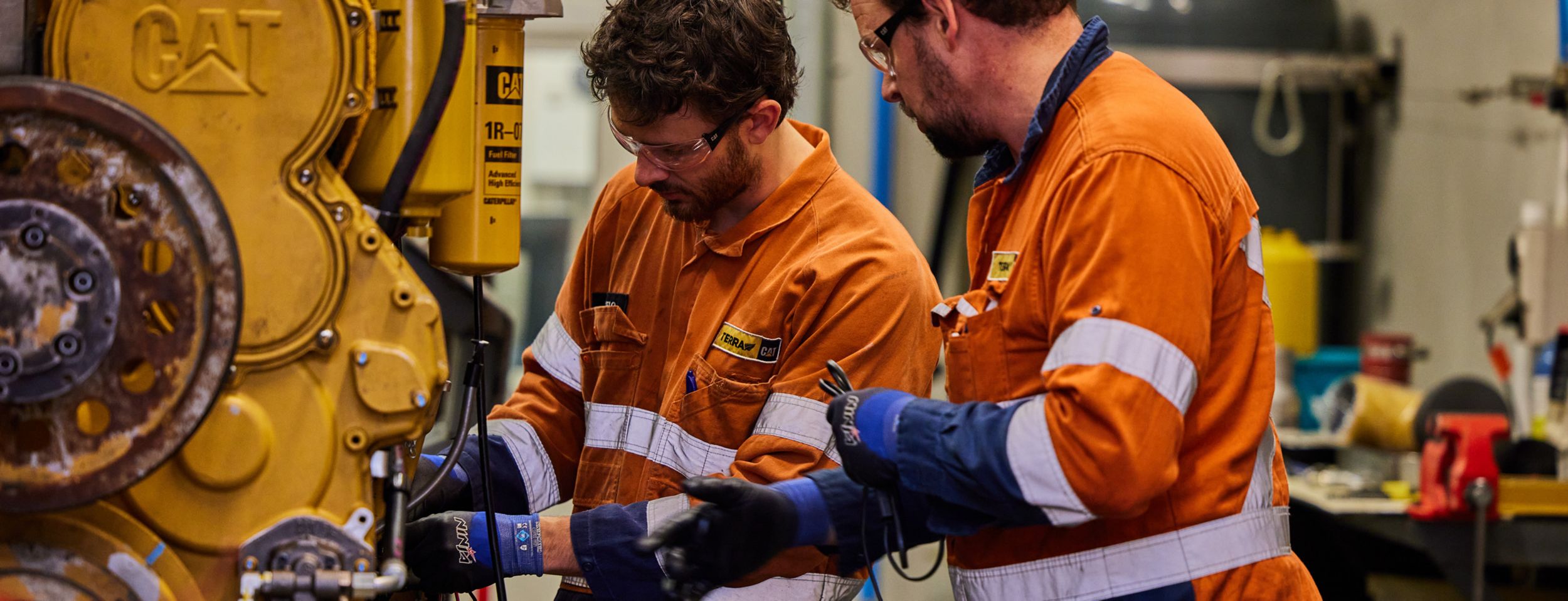 2 technicians remanufacturing an engine