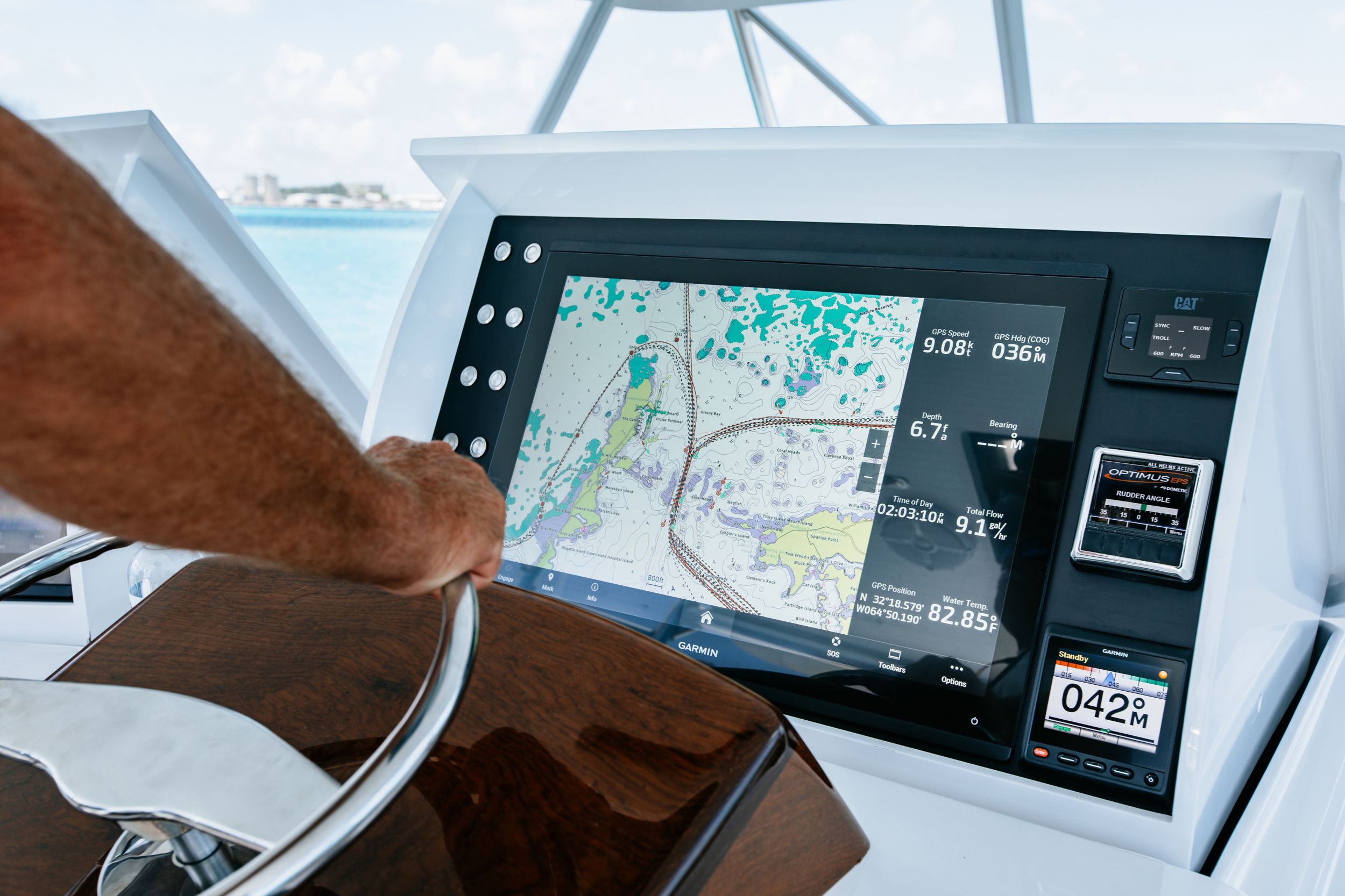 captain at helm with full dash 