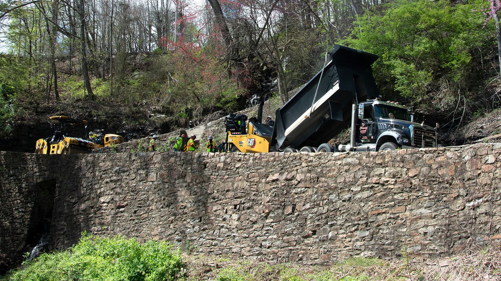 A Cat AP600 paver lays asphalt down on the W Road switchbacks near Chattanooga, Tennessee.