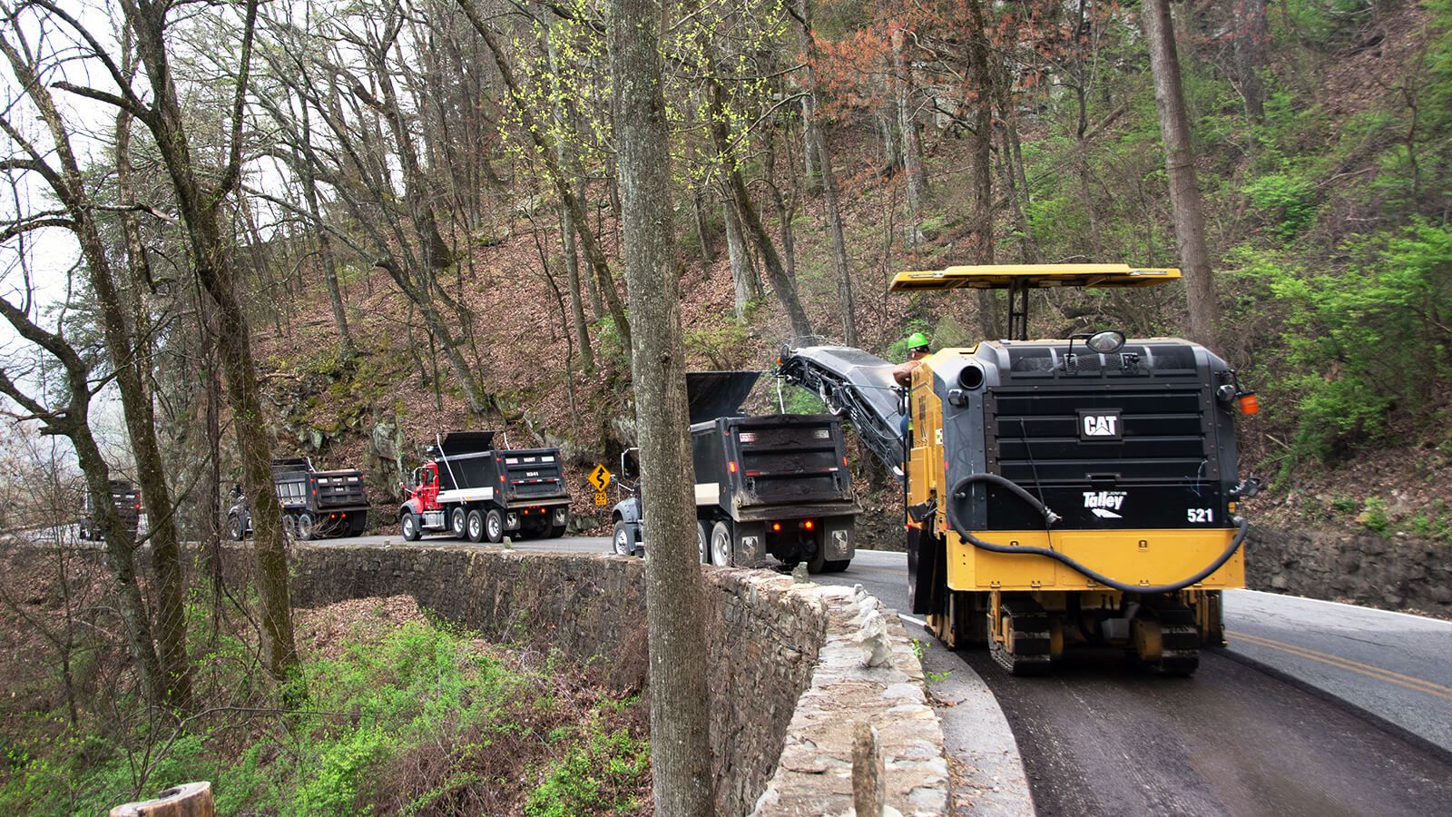 A Cat PM825 cold planer mills asphalt on the W Road near Chattanooga, Tennessee.