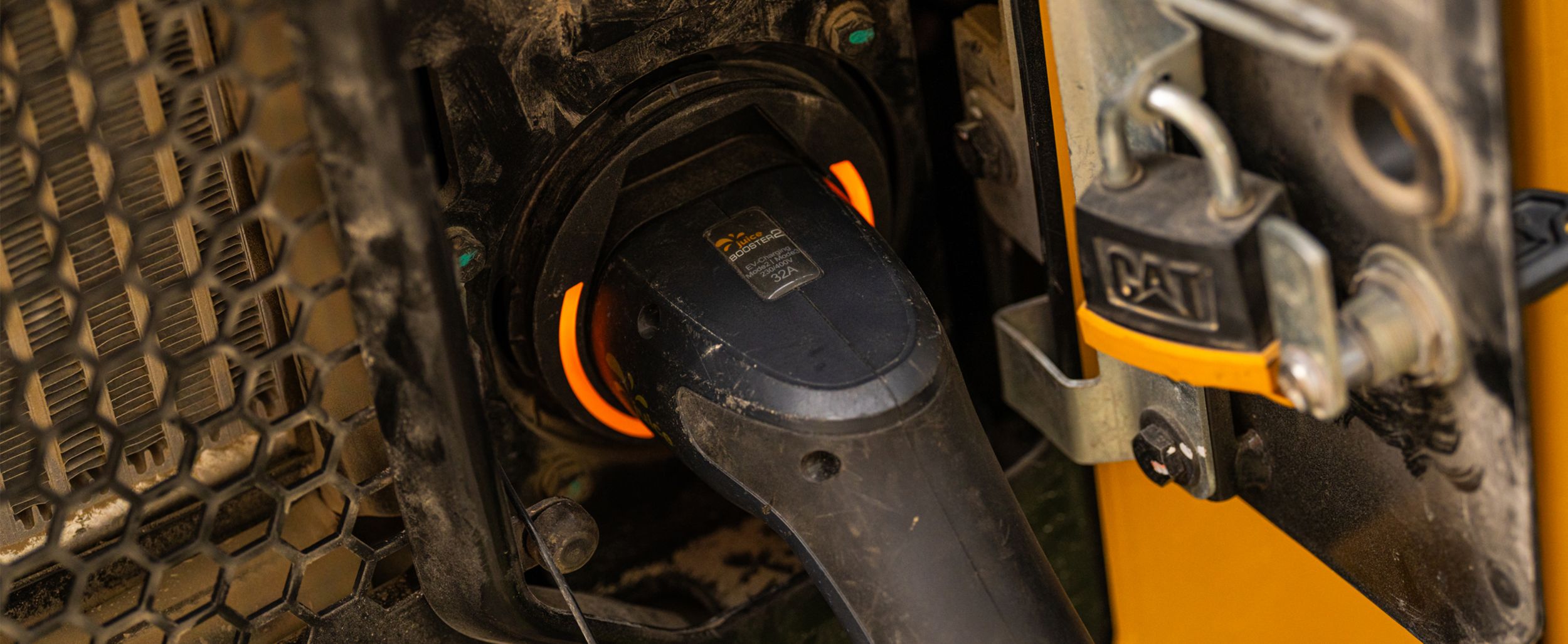 Close-up of a charger being used on a Cat machine