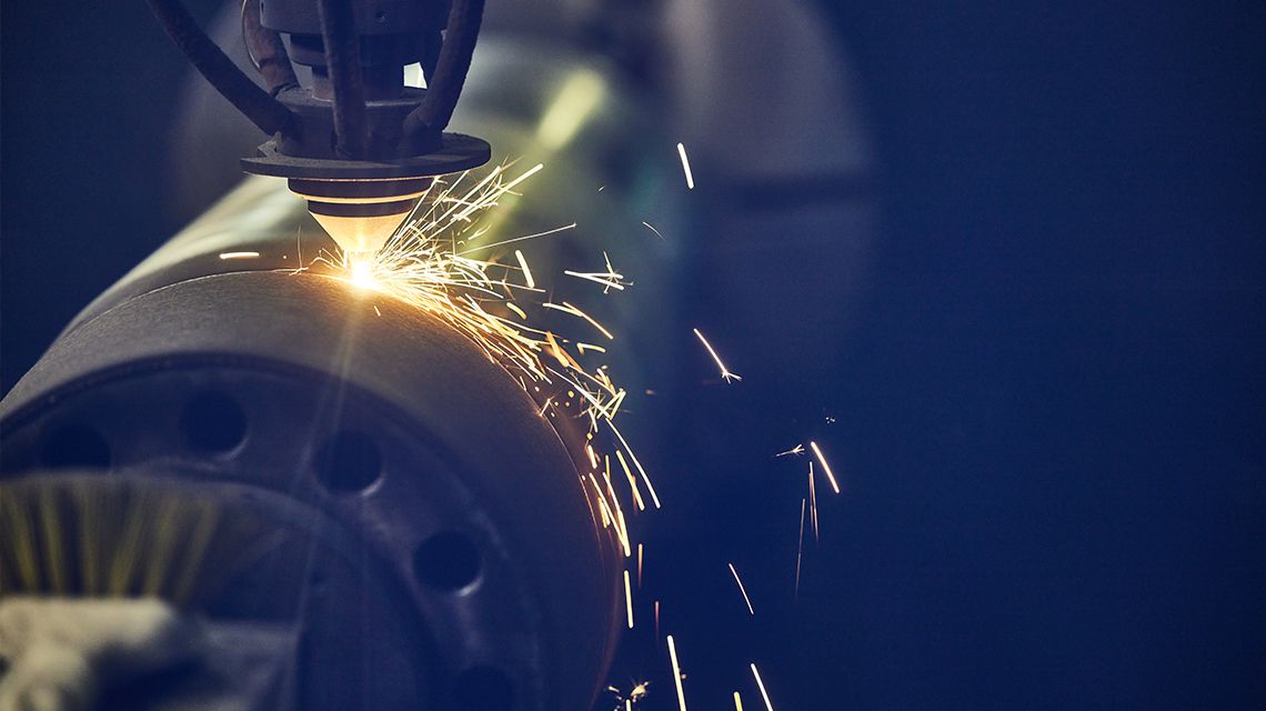 Mining machining tool working on metal parts causing sparks